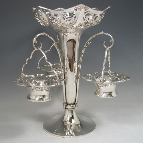    Antique Edwardian sterling silver pierced basket epergne with central vase and three removable pierced baskets. Made by Elkington & Co., of London in 1906. Height 33 cms, spread 30 cms. Weight approx. 43 troy ounces.