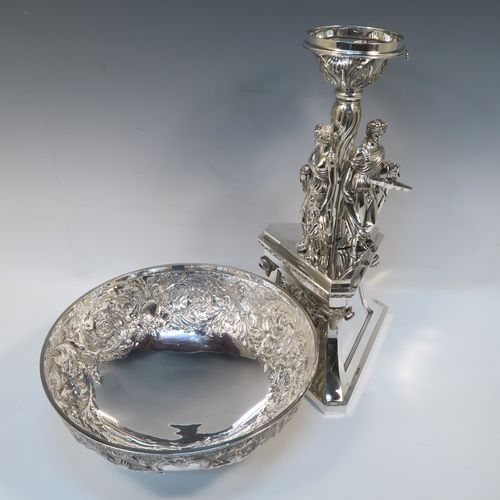 A beautiful and impressive Scottish Antique Victorian Sterling Silver epergne centre-piece, having a top bowl with hand-chased floral, scroll and figural decoration, above a central area consisting of three separate cast caryatid female figures, all sitting on a triangular plinth with tapering sides and applied figural and scroll motifs. This wonderful antique silver centrepiece epergne was made by Marshall and Sons of Edinburgh, Scotland, in 1837. The dimensions of this fine hand-made silver centre-piece are height 47.5 cms (18.75 cms), diameter of bowl 28 cms (11 inches), and it weighs approx. 3,680g (118.7 troy ounces).   