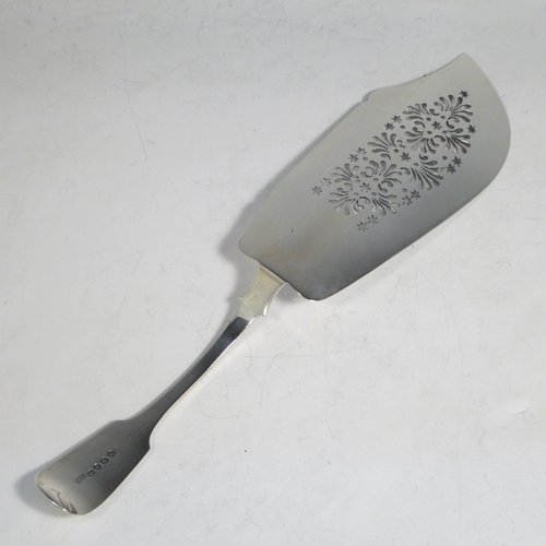 Antique Georgian sterling silver fish server slice, having a plain Fiddle pattern handle, a hand-pierced asymmetrical and curved blade, and a hand-engraved reeded border. Made by William Eley of London in 1830. The dimensions of this fine hand-made silver fish serving slice are length 30 cms (11.75 inches), and it weighs approx. 119g (3.8 troy ounces).   