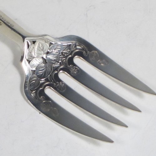 Antique early Victorian sterling silver fish serving knife and fork set, having filled handles in the double-struck Kings pattern, hand-pierced and hand-engraved blade and tines with floral and leaf decoration, the blade with a cartouche engraved with a lady holding a tray of fish. Made by Francis Higgins of London in 1849. The dimensions of this fine hand-made silver fish serving set are length of knife 33 cms (13 inches), and length of fork 24 cms (9.5 inches). Please note that the handles have a number of small dents, but are otherwise in very good condition.  