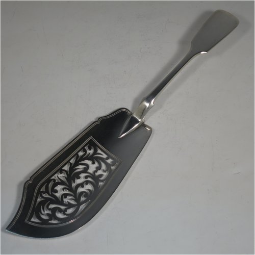 Antique Georgian sterling silver fish server slice, having a plain Fiddle pattern handle, a hand-pierced asymmetrical and curved blade, and a hand-engraved reeded border. Made by William Eley of London in 1838. The dimensions of this fine hand-made silver fish serving slice are length 30 cms (11.75 inches), and it weighs approx. 140g (4.5 troy ounces).   