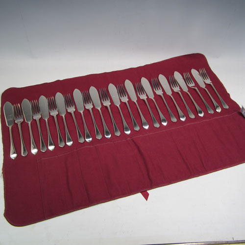 Sterling silver set of fish eaters for twelve people in the Pembury pattern, having spoon-handled fish knives and four-tined forks. All made by Mappin and Webb of Sheffield in 1936. The dimensions of this fine hand-made silver set of fish-eaters are length of knife 19 cms (7.5 inches), and fork 17 cms (7.75 inches), and they weigh a total of 1,256g (40.5 troy ounces). Please note that a tarn-proof roll is provided within the price.