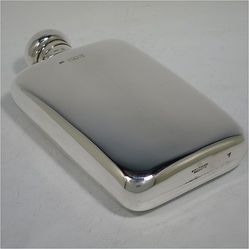 A large Antique Sterling Silver whisky hip flask, having a plain shaped rectangular body with rounded shoulders, and a bayonet-fit lid. Made by Hamilton and Co., of London in 1911. The dimensions of this fine hand-made antique silver hip whisky flask are length 18 cms (7 inches), width 9.5 cms (3.75 inches), depth 3.5 cms (1.3 inch), and it weighs approx. 226g (7.3 troy ounces).    