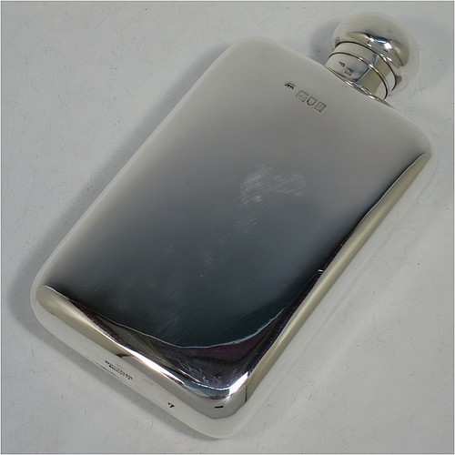 A large Antique Sterling Silver whisky hip flask, having a plain shaped rectangular body with rounded shoulders, and a bayonet-fit lid. Made by Hamilton and Co., of London in 1911. The dimensions of this fine hand-made antique silver hip whisky flask are length 18 cms (7 inches), width 9.5 cms (3.75 inches), depth 3.5 cms (1.3 inch), and it weighs approx. 226g (7.3 troy ounces).    