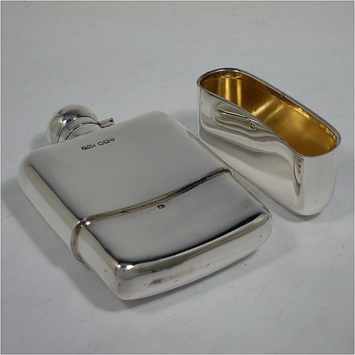 A very handsome Antique Victorian Sterling Silver whisky hip flask, having a plain shaped rectangular body with rounded shoulders, a bayonet-fit lid, and a pull-off cup with gold-gilt interior. Made by James Dixon and Sons of Sheffield in 1896. The dimensions of this fine hand-made antique silver whisky flask are length 12.5 cms (5 inches), width 8 cms (3.25 inches), depth 2.5 cms (1 inch), and it weighs approx. 209g (6.7 troy ounces).