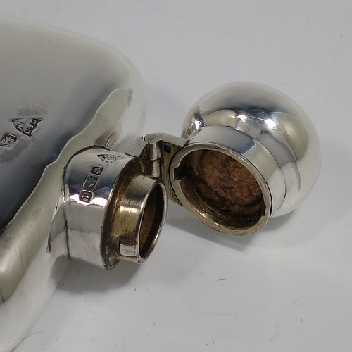 A very handsome Antique Sterling Silver whisky hip flask, having a plain shaped rectangular body with rounded shoulders, a bayonet-fit lid, and a pull-off cup with gold-gilt interior. Made by G. and J. W. Hawksley of Birmingham in 1911. The dimensions of this fine hand-made antique silver whisky flask are length 12 cms (4.75 inches), width 7.5 cms (3 inches), depth 2.5 cms (1 inch), and it weighs approx. 187g (6 troy ounces).   