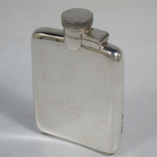 A handsome Sterling Silver whisky hip flask, having a plain shaped rectangular body with rounded shoulders, and a hinged bayonet-fit lid with knurled thumb-piece. Made by Mappin and Webb of Birmingham in 1928. The dimensions of this fine hand-made silver whisky flask are length 10 cms (4 inches), width 7 cms (2.75 inches), depth 2 cms (0.75 inches) and it weighs approx. 104g (3.4 troy ounces).    