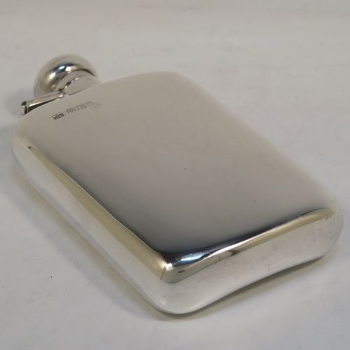 A heavy Sterling Silver whisky hip flask, having a plain shaped rectangular body with rounded shoulders, and a round hinged bayonet-fit lid. This elegant silver whisky flask was made by Robin Pringle of London in 1947. The dimensions of this fine hand-made silver hip whisky flask are length 15 cms (6 inches), width 8.5 cms (3.3 inches), depth 2.5 cms (1 inch), and it weighs approx. 250g (8 troy ounces).  