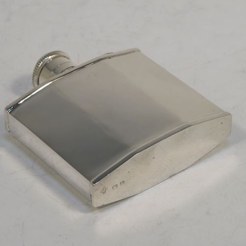 A very elegant Sterling Silver Art Deco style whisky flask, having a plain square panelled body, plain flat shoulders and sides, and a hinged and bayonet-fit lid with knurled top. This handsome silver flask was made by William Base and Sons of Birmingham in 1928. The dimensions of this fine hand-made silver whisky hip flask are height 7.5 cms (3 inches), width 7 cms (2.75 inches), depth 2 cms (0.75 inch), and it weighs approx. 70g (2.3 troy ounces).  