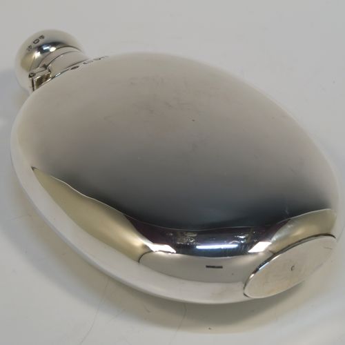 A very large and handsome Antique Victorian Sterling Silver whisky hip flask, having a plain oval body, and a round bayonet-fit lid. This elegant silver whisky flask was made by William Hutton and Sons of London in 1895. The dimensions of this fine hand-made antique silver flask are length 18.5 cms (7.25 inches), width 11 cms (4.25 inches), and it weighs approx. 261g (8.4 troy ounces).   