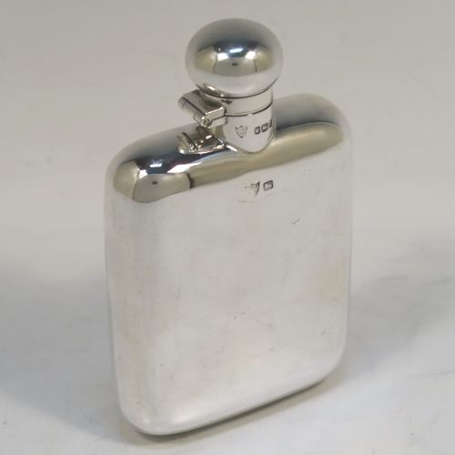 A very elegant Antique Edwardian Sterling Silver whisky hip flask, having a plain shaped rectangular body with rounded shoulders, and a round bayonet-fit lid. This handsome antique silver whisky flask was made by G. and J. W. Hawksley of Sheffield in 1909. The dimensions of this fine hand-made silver hip whisky flask are length 12 cms (4.75 inches), width 8 cms (3 inches), depth 2.5 cms (1 inch), and it weighs approx. 130g (4.2 troy ounces).   