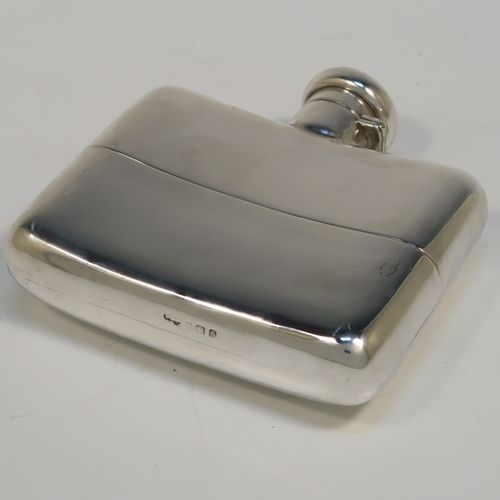 A heavy and very handsome Antique Sterling Silver whisky hip flask, having a plain shaped rectangular body with rounded shoulders, a bayonet-fit lid, and a pull-off cup with gold-gilt interior. This elegant antique silver whisky flask and cup were made by Deakin and Francis of Birmingham in 1917. The dimensions of this fine hand-made antique silver whisky flask are length 12 cms (4.75 inches), width 12 cms (4.75 inches), depth 4 cms (1.5 inches), and it weighs approx. 272g (8.8 troy ounces).   