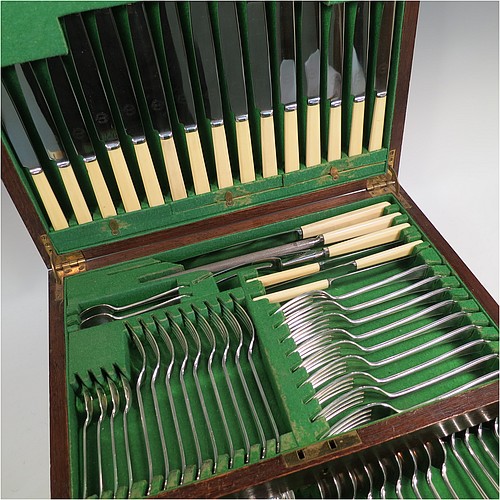 A very stylish Art Deco Sterling Silver Newlyn pattern flatware / cutlery service for nine people in original oak canteen, having 69 pieces total including 9 table forks, 9 dessert forks, 4 table spoons, 9 dessert spoons, 6 coffee spoons, 9 teaspoons, 9 bone-handled table knives, 9 bone-handled dessert knives, a pair of sauce ladles, and a 3-piece bone-handled carving set. All made by Frank Cobb an Co. Ltd., of Sheffield in 1936. The dimensions of this fine hand-made silver cutlery service are length of table fork 19 cms (7.5 inches), length of largest spoon 21 cms (8.25 inches), and the total weight is 2,170g (70 troy ounces). 