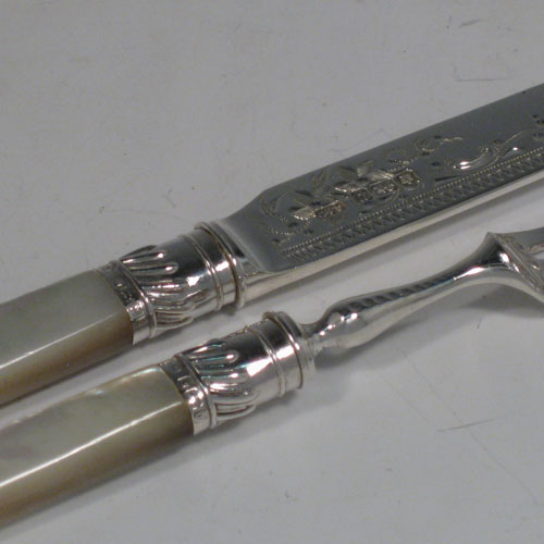 Antique Edwardian sterling silver and mother-of-pearl fruit set for 12 people. Having engraved knife blades and three-prong forks, fluted ferrules connecting the mother-of-pearl handles, and having green velvet storage rolls. Made by Allen and Darwin of Sheffield in 1907. Length of knife 18 cms (7 inches), length of fork 15 cms (6 inches). Please note that this set does NOT include the storage bags as they have been sold.