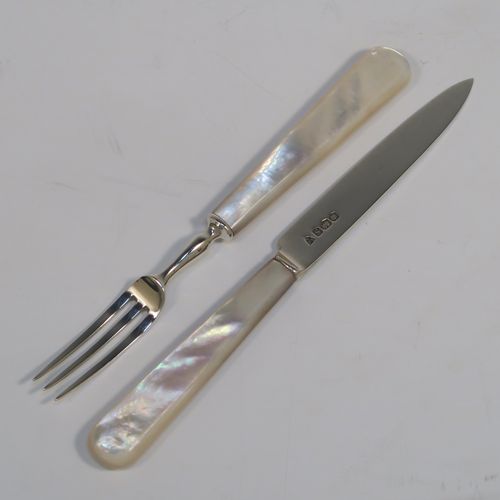 A very elegant Sterling Silver and mother-of-pearl handled fruit set for twelve people. Having plain straight-sided pointed-end blade knives, and three-prong forks. All fitted into an original presentation box with cream satin and black velvet-lined interior. This handsome silver and mother-of-pearl fruit eating set was made by Charles James Allen of Sheffield in 1935. The dimensions of this fine hand-made silver fruit service are length of knife 15 cms (6 inches), and the length of the fork 13.5 cms (5.3 inches).   