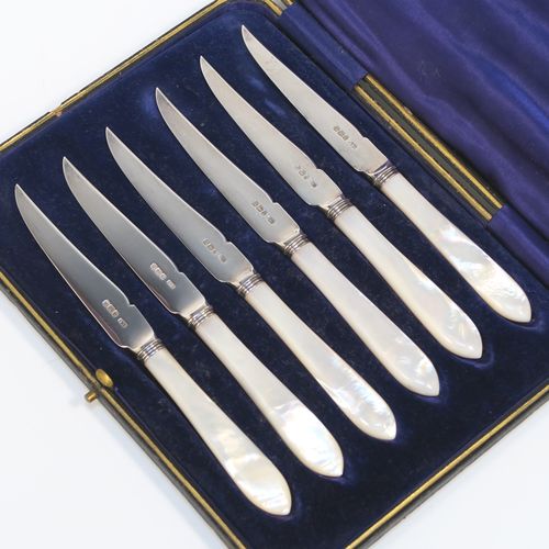 A very elegant set of six Antique Edwardian Sterling Silver and mother-of-pearl handled fruit fruit eating knives, having plain pointed-end bladed knives, all fitted into an original dark blue satin and velvet-line presentation box. This handsome silver fruit eater set was made by Allen and Darwin of Sheffield in 1903. The dimensions of this fine set of hand-made silver and mother-of-pearl fruit knives are length 16.5 cms (6.5 inches). Please note that the box is slightly damaged on one side.