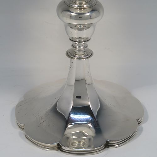 A large and handsome Antique early Victorian Sterling Silver goblet, having a plain round tapering body with a gold-gilt interior and an applied reeded top border, a stem with a round middle baluster, and sitting on a spreading panelled octofoil pedestal foot. This large and beautiful silver goblet was made by Robert Hennell III of London in 1842. The dimensions of this fine hand-made antique silver goblet are height 24.5 cms (9.75 inches), diameter at lip 10 cms (4 inches), and it weighs approx. 451g (14.5 troy ounces).  