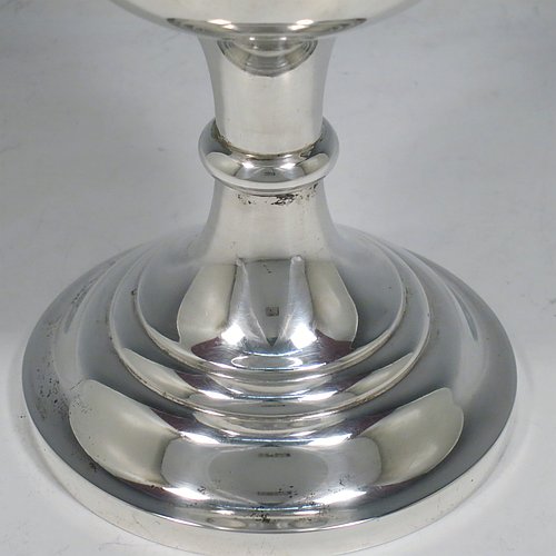 A large Antique Victorian Sterling Silver goblet, having a plain round baluster body with applied reeded border, hand-engraved on one side with a contemporaneous full inscription, a gold-gilt interior, and sitting on a pedestal foot. This handsome silver goblet was made by Walker & Hall of Sheffield in 1901. The dimensions of this fine hand-made antique silver goblet are height 19.5 cms (7.75 inches), diameter at lip 11 cms (4.25 inches), and it weighs approx. 375g (12 troy ounces).   