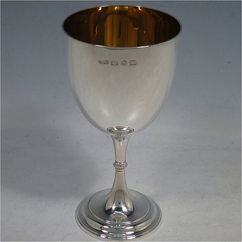 An Antique Victorian Sterling Silver goblet, having a plain round tapering body, and sitting on a pedestal foot with an applied beaded band, and a gold-gilt interior. Made by Elkington & Co., of Birmingham in 1892. The dimensions of this fine hand-made antique silver goblet are height 16.5 cms (6.5 inches), diameter at lip 8.5 cms (3.3 inches), and it weighs approx. 153g (5 troy ounces).   