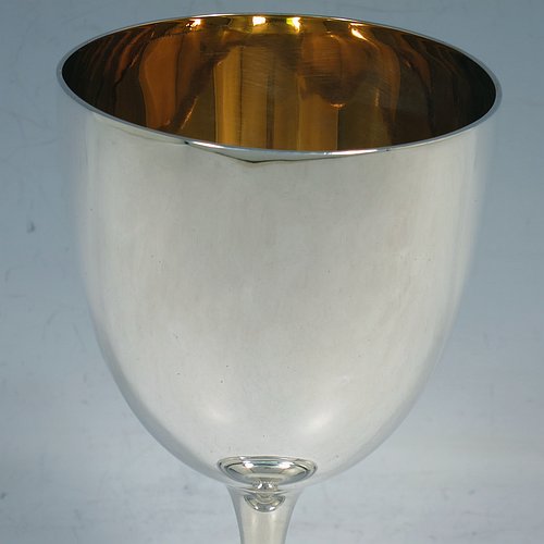 An Antique Victorian Sterling Silver goblet, having a plain round tapering body, and sitting on a pedestal foot with an applied beaded band, and a gold-gilt interior. Made by Elkington & Co., of Birmingham in 1892. The dimensions of this fine hand-made antique silver goblet are height 16.5 cms (6.5 inches), diameter at lip 8.5 cms (3.3 inches), and it weighs approx. 153g (5 troy ounces).   