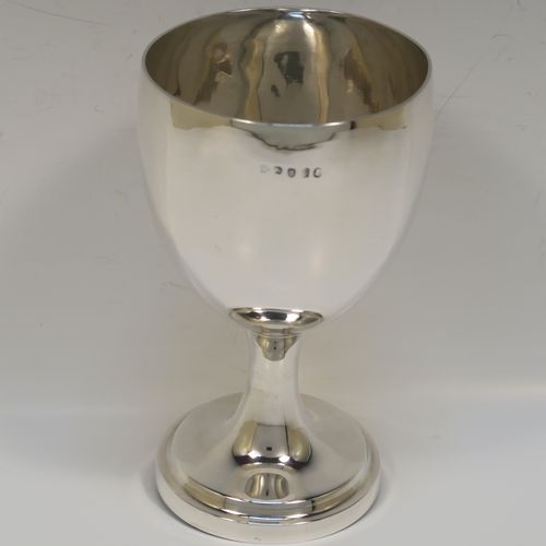 A handsome Antique Georgian Sterling Silver goblet, having a plain round bellied body, sitting on a plain round pedestal foot. This elegant silver goblet was made by Thomas Hobbs of London in 1814. The dimensions of this fine hand-made antique silver goblet are height 15 cms (6 inches), diameter at lip 8.5 cms (3.3 inches), and it weighs approx. 160g (5.2 troy ounces).   