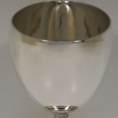 A handsome Antique Georgian Sterling Silver goblet, having a plain round bellied body, sitting on a plain round pedestal foot. This elegant silver goblet was made by Thomas Hobbs of London in 1814. The dimensions of this fine hand-made antique silver goblet are height 15 cms (6 inches), diameter at lip 8.5 cms (3.3 inches), and it weighs approx. 160g (5.2 troy ounces).   