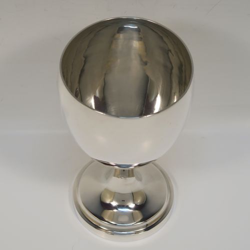 A handsome Antique Georgian Sterling Silver goblet, having a plain round bellied body, sitting on a plain round pedestal foot. This elegant silver goblet was made by Thomas Hobbs of London in 1814. The dimensions of this fine hand-made antique silver goblet are height 15 cms (6 inches), diameter at lip 8.5 cms (3.3 inches), and it weighs approx. 160g (5.2 troy ounces).   