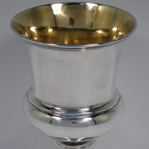 A very handsome Antique Scottish Georgian Sterling Silver wine goblet, having a plain round campania or campagna style bellied body with an applied reeded upper border, a gold-gilt interior, and sitting on a pedestal foot with an applied straight gadroon border. Made by William Jamieson of Edinburgh in 1803. The dimensions of this fine hand-made antique silver campagna or campania style wine goblet are height 15.5 cms (6 inches), diameter at lip 10 cms (4 inches), and it weighs approx. 221g (7 troy ounces).