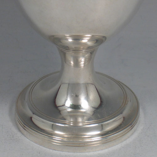 A very elegant Antique Georgian Sterling Silver goblet, having a plain round tapering body with reeded borders, and sitting on a pedestal foot. This handsome antique silver goblet was made by William Bateman (poss.) of London in 1826. The dimensions of this fine hand-made silver goblet are height 12.5 cms (5 inches), diameter at lip 9 cms (3.5 inches), and it weighs approx. 168g (5.4 troy ounces).
