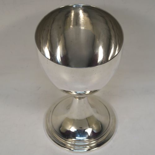 A large and very handsome Antique Georgian Sterling Silver goblet, having a plain round tapering body, sitting on a pedestal foot with a reeded border. This elegant antique silver goblet was made by Robert Scott II of Newcastle in ca. 1800. The dimensions of this fine hand-made antique silver goblet are height 16 cms (6.3 inches), diameter at lip 9.5 cms (3.75 inches), and it weighs approx. 194g (6.3 troy ounces).  