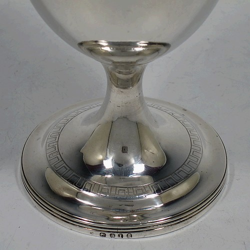 A large and very handsome Antique Georgian Sterling Silver goblet, having a round tapering body with a top band of hand-engraved Greek-key decoration, sitting on a pedestal foot with a reeded border, and with a gold-gilt interior. Made in London in 1804. The dimensions of this fine hand-made antique silver goblet are height 16.5 cms (6.5 inches), diameter at lip 9 cms (3.5 inches), and it weighs approx. 278g (9 troy ounces).    