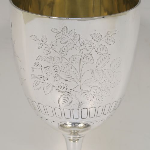 A very pretty Antique Victorian Sterling Silver goblet, having a round straight-sided and bellied body with hand-engraved floral and fern decoration, a gold-gilt interior, and sitting on a pedestal foot with hand-engraved decoration and an applied bead-edged border. This beautiful antique silver goblet was made by Frederick Elkington of London in 1873. The dimensions of this fine hand-made antique silver goblet are height 18.5 cms (7.25 inches), diameter at lip 9 cms (3.5 inches), and it weighs approx. 205g (6.6 troy ounces).   