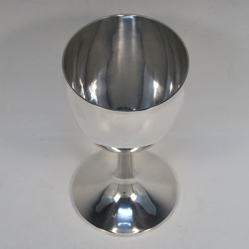 A large and very handsome Antique Georgian Sterling Silver goblet, having a plain round tapering body, sitting on a plain round pedestal foot, and with a reeded top border. This elegant antique silver goblet was made by Hawksworh Eyres and Co., of Sheffield in 1833. The dimensions of this fine hand-made antique silver goblet are height 17 cms (6.75 inches), diameter at lip 9 cms (3.5 inches), and it weighs approx. 258g (8.3 troy ounces).  