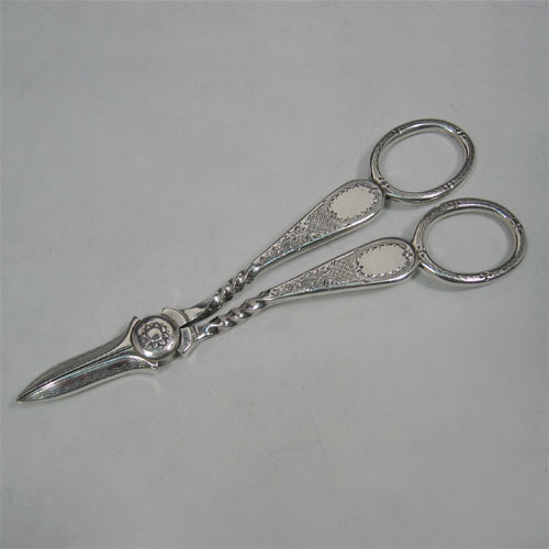 Antique Victorian, sterling silver, hand-engraved pair of grape scissors, made by Henry Atkin of Sheffield in 1895. Length 14 cms.