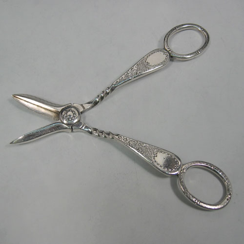 Antique Victorian, sterling silver, hand-engraved pair of grape scissors, made by Henry Atkin of Sheffield in 1895. Length 14 cms.