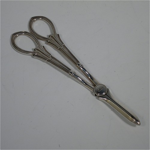 A Sterling Silver pair of grape shears or scissors in the double-struck Albany pattern. Made by George Howson of Sheffield in 1928. The dimensions of this fine hand-made pair of silver grape scissors or shears are length 19 cms (7.5 inches), and they weigh approx. 124g (4 troy ounces).    