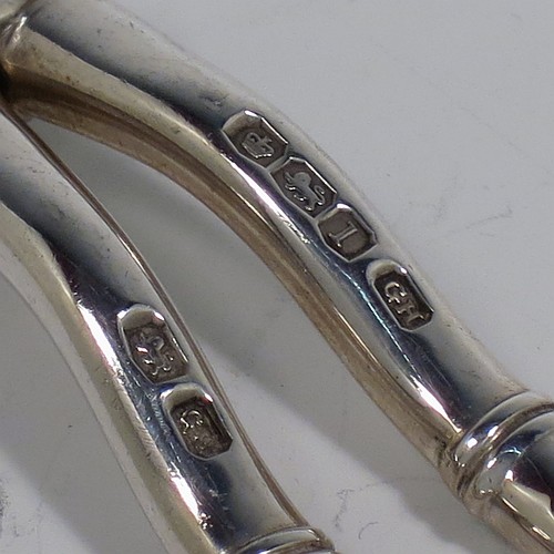 A Sterling Silver pair of grape shears or scissors in the double-struck Albany pattern. Made by George Howson of Sheffield in 1928. The dimensions of this fine hand-made pair of silver grape scissors or shears are length 19 cms (7.5 inches), and they weigh approx. 124g (4 troy ounces).    