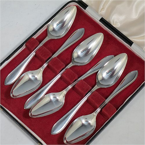 A Sterling Silver set of six grape-fruit spoons, having plain pointed oval bowls, and reeded Sandringham pattern handles, all in original white satin and dark red velvet-lined presentation box. Made by Emile Viner of Sheffield in 1962. The dimensions of these fine hand-made grapefruit spoons are length 14 cms (5.5 inches), and they weigh a total of 185g (6 troy ounces).   