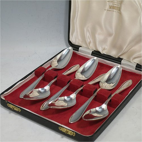 A Sterling Silver set of six grape-fruit spoons, having plain pointed oval bowls, and reeded Sandringham pattern handles, all in original white satin and dark red velvet-lined presentation box. Made by Emile Viner of Sheffield in 1962. The dimensions of these fine hand-made grapefruit spoons are length 14 cms (5.5 inches), and they weigh a total of 185g (6 troy ounces).   