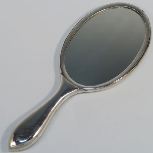 A beautiful Antique Victorian Indian Sterling Silver hand-mirror, having an oval body with a hand-chased scene of animals including lions, deer, dogs, leopards, and elephants, surrounding a central vacant round  cartouche, and an oval mounted mirror in a plain frame. This fantastic silver hand mirror was probably made for the Indian market in ca. 1880. The dimensions of this fine hand-made silver hand mirror are length 28 cms (11 inches), and width of main body 11 cms (4.3 inches).   