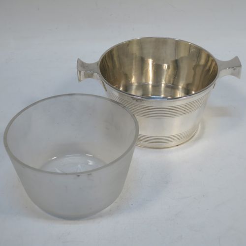 A very handsome Antique Victorian Sterling Silver and crystal honey, jam, or conserve jar, in the shape of a Quaich, having a plain round body with tapering sides and reeded decoration, two side handles, and with a frosted cut crystal insert with a star-cut base. Made by Martin Hall and Co., of Sheffield in 1896. The dimensions of this fine hand-made silver and crystal Quaich style conserve, jam, or honey jar are height 6 cms (5.5 inches), diameter 10 cms (4 inches), and it weighs approx. 235g (7.6 troy ounces).  