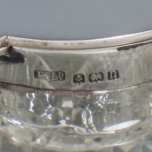 An Antique Edwardian Sterling Silver and hand-cut crystal inkstand, having a square body with chamfered corners, a plain round silver mount with a hinged lid and an unusual attached pen holder, and all sitting on a hand-cut hobnail pattern flat base. Made by Finnigans Ltd., of Birmingham in 1902. The dimensions of this fine hand-made antique silver and crystal inkstand are height 9 cms (3.5 inches), and 10 cms (4 inches) square.   