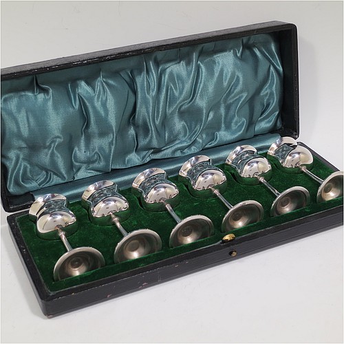 A very handsome Antique Sterling Silver set of six liqueor tots or measures, having plain round bellied goblet style bodies with gold-gilt interiors, sitting on round pedestal feet, and all fitted in their original green satin and velvet-lined presentation box. Made by Philip Hanson Abbot of London in 1912. The dimensions of this fine hand-made antique silver liqueur tots are height 7.5 cms (3 inches), diameter 3.5 cms (1.3 inches), and the total weight is approx. 208g (6.7 troy ounces).    