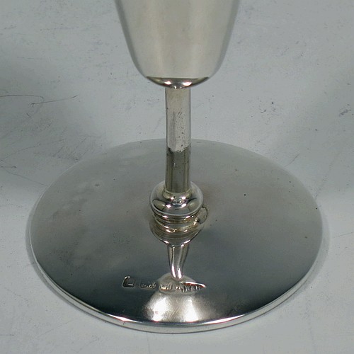 A handsome Antique Edwardian Sterling Silver set of six liqueor tots or measures, having very plain round bodies with tapering sides, sitting on round pedestal feet, and all fitted in their original satin and blue velvet-lined presentation box. Made by Walker and Hall of Birmingham in 1908. The dimensions of this fine hand-made antique silver liqueur tots are height 7.5 cms (3 inches), diameter at base 4.5 cms (1.75 inches), and the total weight is approx. 143g (4.6 troy ounces).    