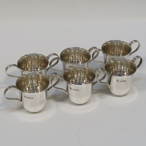 A handsome Antique Sterling Silver set of six liqueor tots or measures in a porringer style, having plain round bodies with tapering sides, two reeded side-handles, and sitting on flat bases. This elegant set of liqueur measures were made by Vale Brothers and Sermon of Birmingham in 1913. The dimensions of this fine hand-made antique silver liqueur tot set are height 4.5 cms (1.75 inches), diameter at lip 4 cms (1.5 inches), and their total weight is approx. 159g (5 troy ounces).  