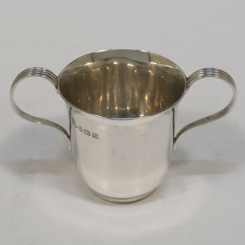 A handsome Antique Sterling Silver set of six liqueor tots or measures in a porringer style, having plain round bodies with tapering sides, two reeded side-handles, and sitting on flat bases. This elegant set of liqueur measures were made by Vale Brothers and Sermon of Birmingham in 1913. The dimensions of this fine hand-made antique silver liqueur tot set are height 4.5 cms (1.75 inches), diameter at lip 4 cms (1.5 inches), and their total weight is approx. 159g (5 troy ounces).  