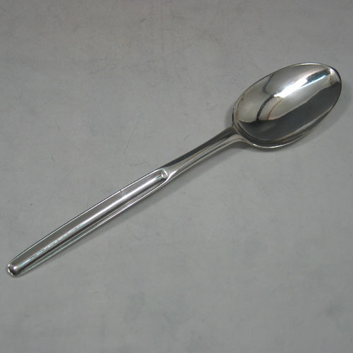 Antique Georgian sterling silver marrow scoop with table spoon end made in London in 1728. Length 21 cms.