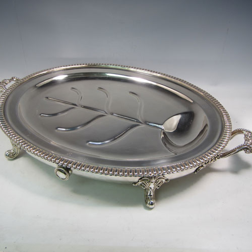 Antique Georgian Old Sheffield plated meat cover dome and platter, having a plain oval body with Regency style gadroon and fluted border, a cast oak-leaf handle, and all sitting on a well and tree dish for carving, having a hot water jacket, and with matching decoration. Both pieces made in ca. 1815 and matched together. The dimensions of this fine hand-made Old Sheffield plated meat cover dome and plate are length (inc. handles) 71cm (28 inches), width 44.5 cms (17.5 inches), and height 36 cms (14 inches). Please note that both items are crested.