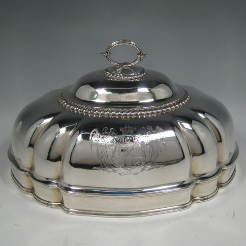    Antique Georgian sterling silver meat cover dome made by Robert Garrard of London in 1823. Length 35 cms (13.75 inches), width 25 cms (9.75 inches), height 20 cms (8 inches). Weight approx. 59 troy ounces (1,829g). Please note that this item has a full armorial family crest on both sides.