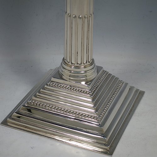 A rare and large Sterling Silver Hanukkah Menorah in a traditional Corinthian style, having a panelled and fluted column, sitting on a stepped base with bead borders. Made by Alexander Titlebaum of London in 1961. The dimensions of this fine hand-made silver menorah are height 46 cms (18 inches), spread across arms 26 cms (10.25 inches), and it weighs approx. 824g (26.5 troy ounces) Please note that this item is NOT filled so the whole weight is silver.    